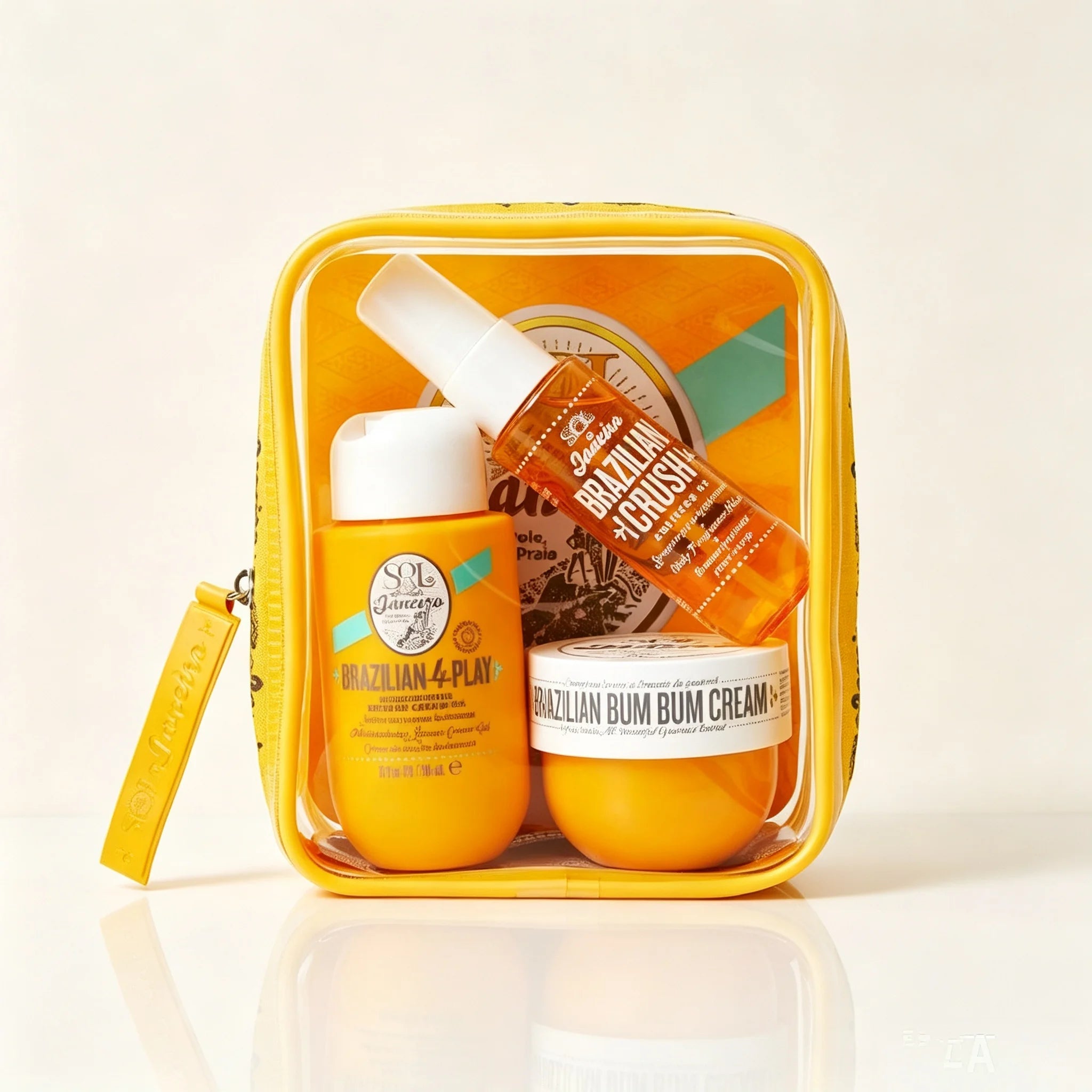 Sol de Janeiro Women's Body Care Travel Set, Moisturizing and Firming Tropical Caramel Nut-Scented Body Cream and Shower Spray, Clear Storage Pouch with Yellow Trim