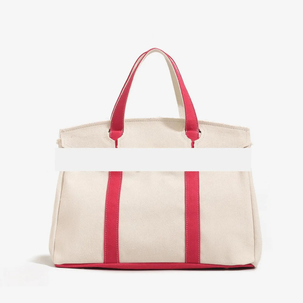 Canvas bag for women 2026 new high-end and niche design, contrasting color handbag, large capacity commuting versatile bag