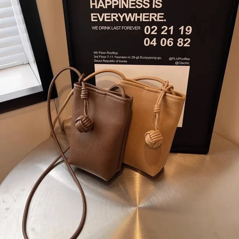 Versatile artistic small fresh small round ball pendant crossbody phone bag, soft leather cute mini bag for women