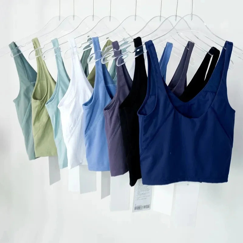 Women's yoga vest with U-shaped straps and built-in breast pads, offering a bare-skin feel suitable for fitness and exercise.