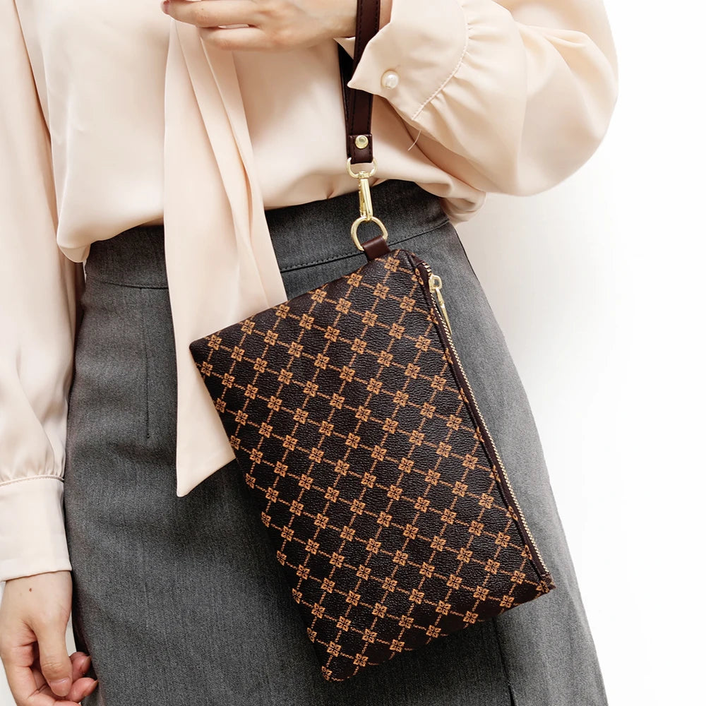 Simple and fashionable European and American printed mobile phone bag women's hand-held portable wallet home storage bag