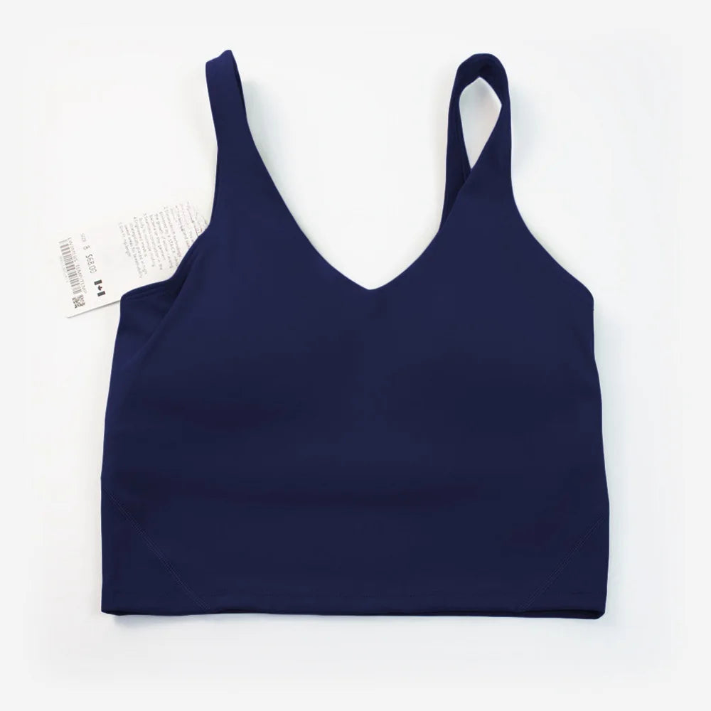 Women's yoga vest with U-shaped straps and built-in breast pads, offering a bare-skin feel suitable for fitness and exercise.