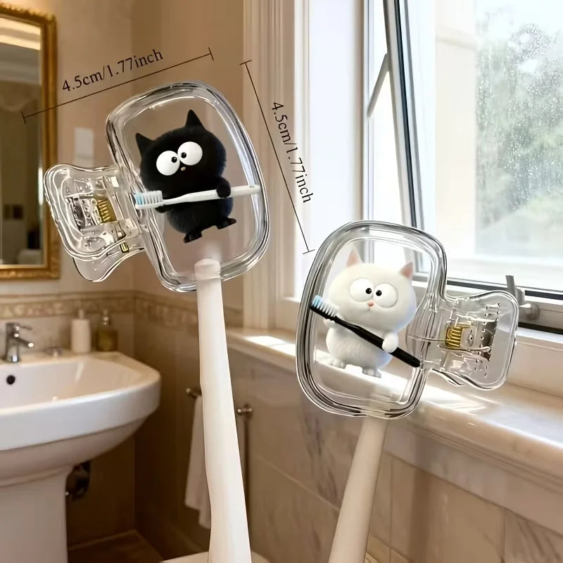 Two white cat toothbrushes and a black cat toothbrush holder, a household toothbrush holder protective cover