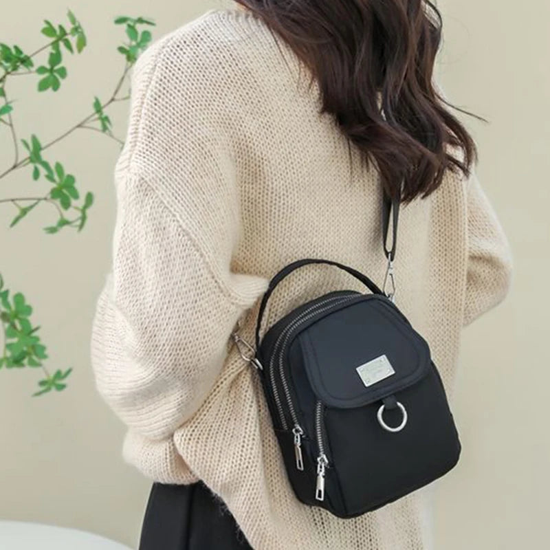 Neutral Style Shoulder Bag for Men and Women, Suitable for Travel and Photography It Is a Cross-Body Bag Made of Oxford Fabric.