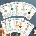 10 heartfelt keychain items, including a pocket-sized card with a message of affection, perfect as a gift.