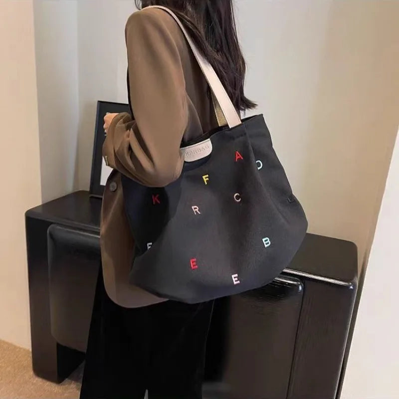 2025 New Canvas Bag Large Capacity Women's Trendy Embroidered Letter Tote Bag Small Fresh Student Shoulder Tote Bag