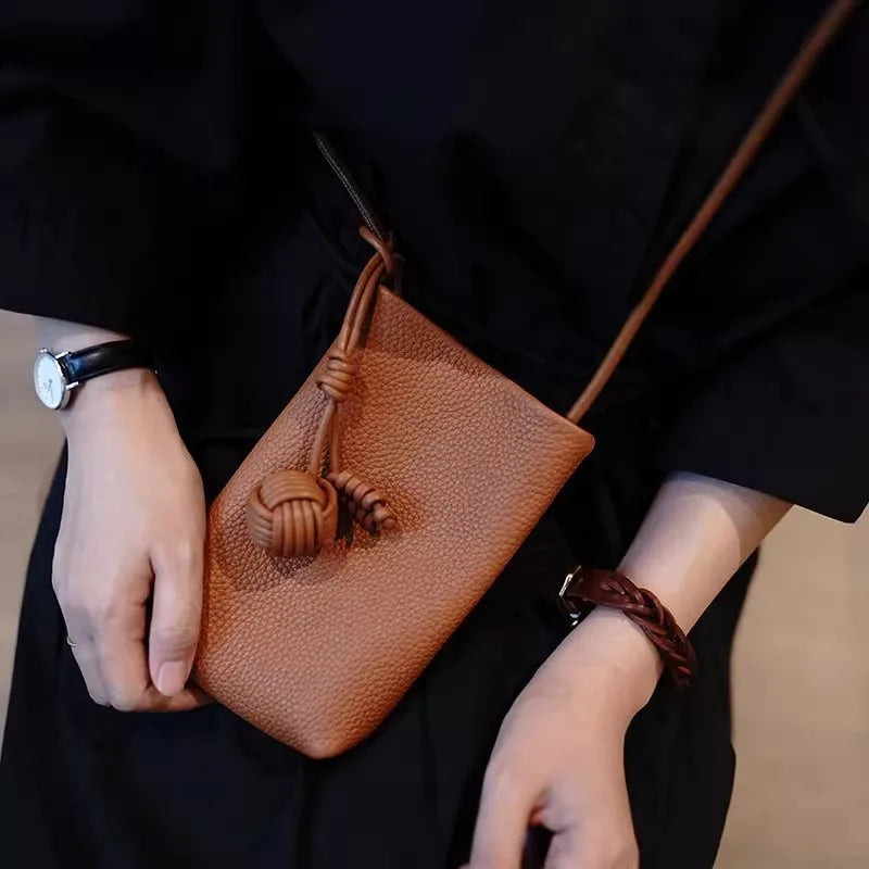Versatile artistic small fresh small round ball pendant crossbody phone bag, soft leather cute mini bag for women