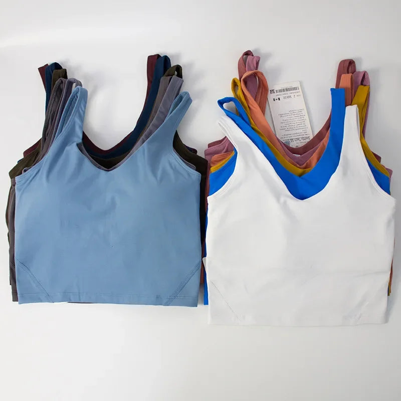 Women's yoga vest with U-shaped straps and built-in breast pads, offering a bare-skin feel suitable for fitness and exercise.