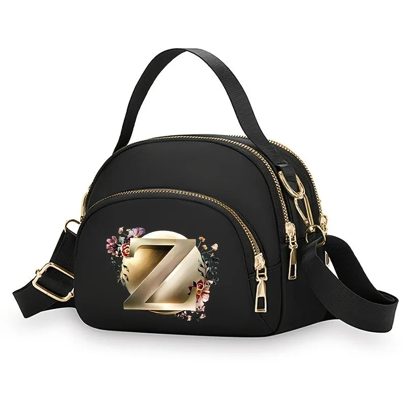 A fashionable women's messenger bag featuring a beautiful floral pattern with 26 letters, multiple compartments, and a large cap