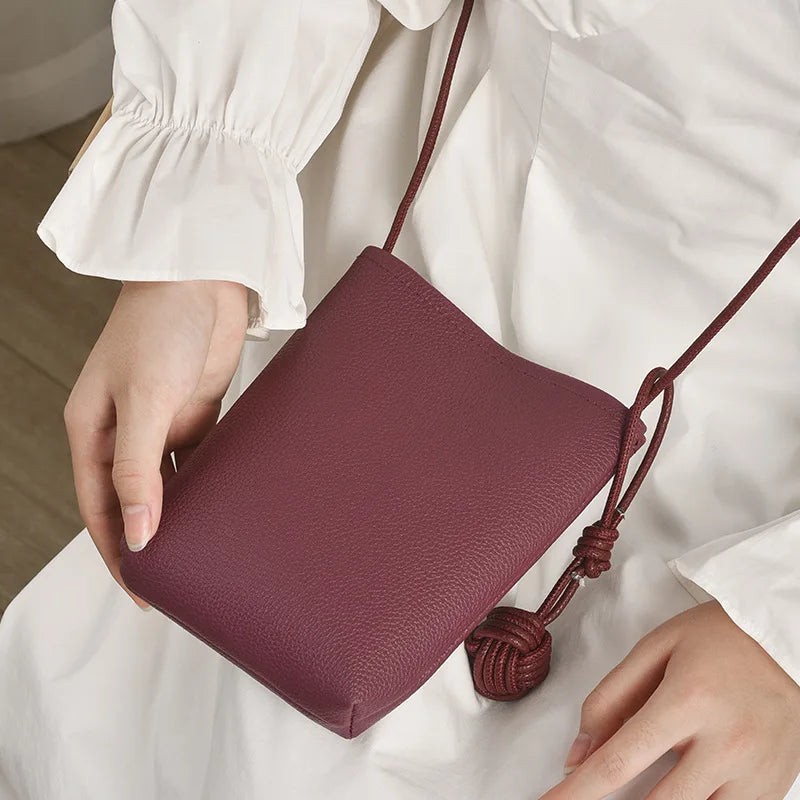 Versatile artistic small fresh small round ball pendant crossbody phone bag, soft leather cute mini bag for women