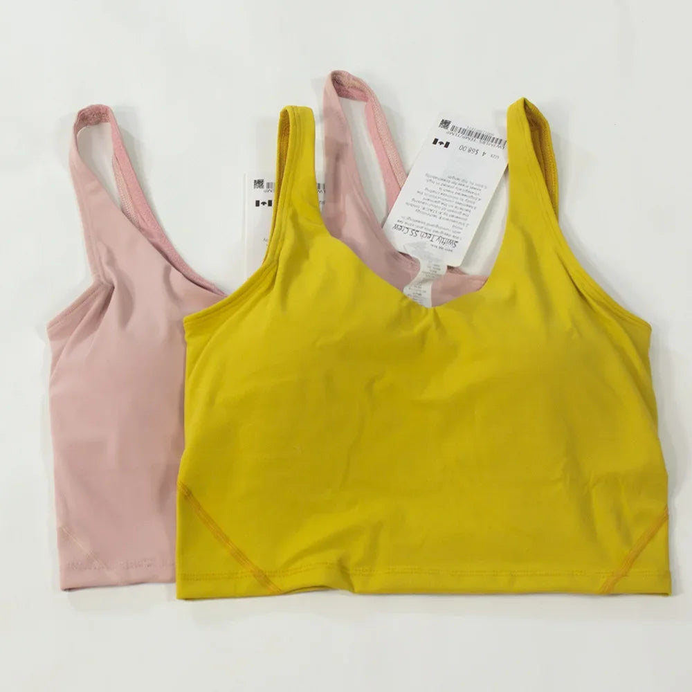 Women's yoga vest with U-shaped straps and built-in breast pads, offering a bare-skin feel suitable for fitness and exercise.