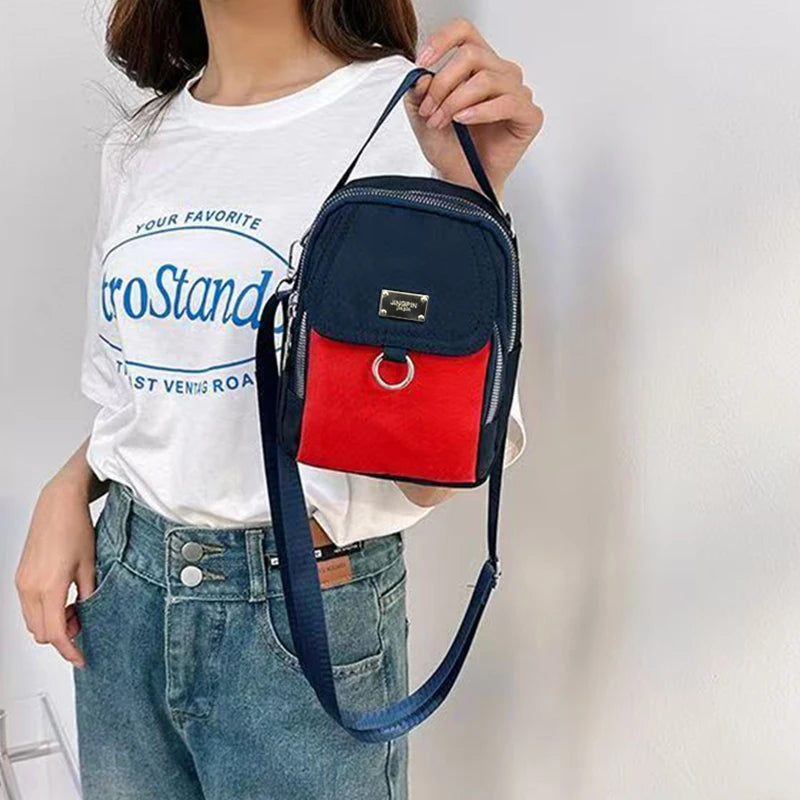 Neutral Style Shoulder Bag for Men and Women, Suitable for Travel and Photography It Is a Cross-Body Bag Made of Oxford Fabric.
