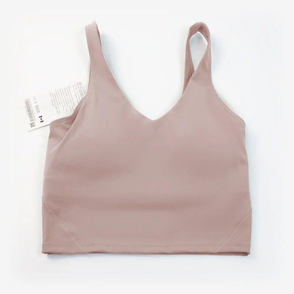 Women's yoga vest with U-shaped straps and built-in breast pads, offering a bare-skin feel suitable for fitness and exercise.