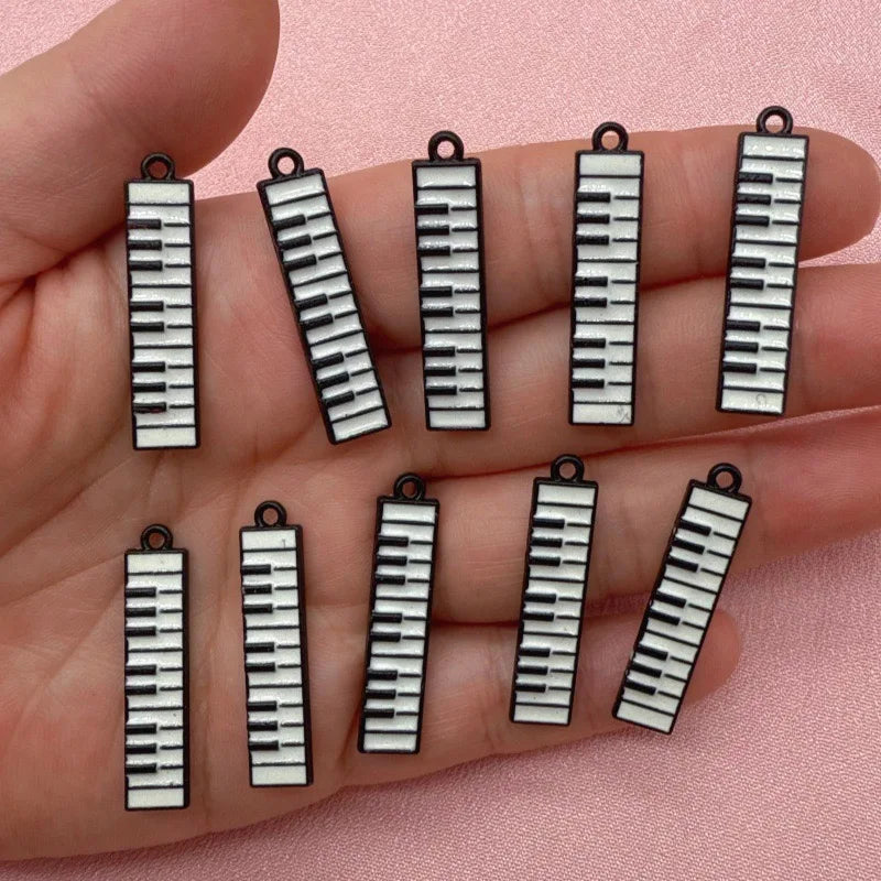 12pcs black and white minimalist alloy drip oil jewelry accessories, piano keyboard keychain, cartoon fashion earrings, hanging