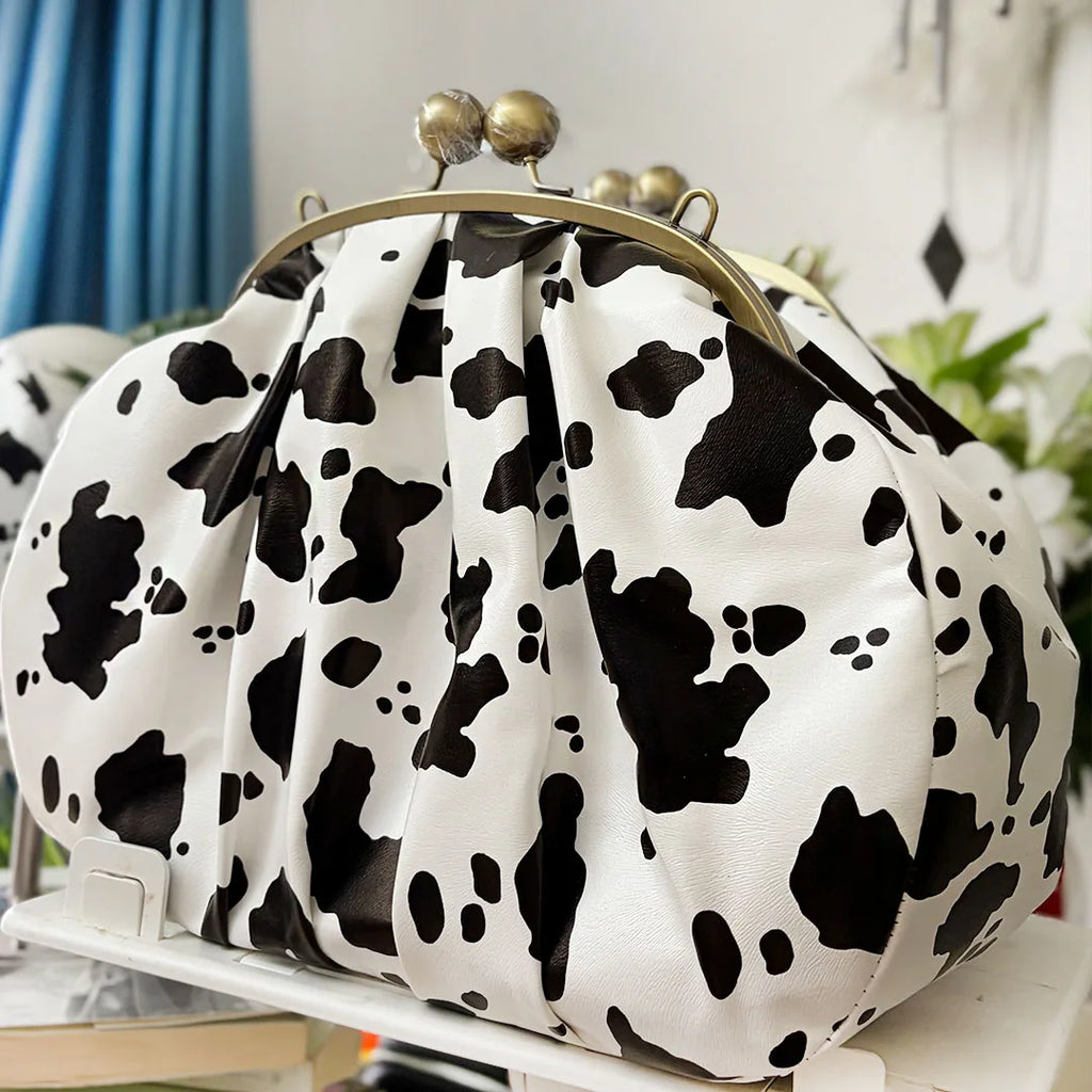 LOST IN VINTAGE Artficial Leather Cow Pattern Fabric Clutch Metal Frame Kiss Lock and Metal Handle Puffy Purse 34x23x11cm Cow