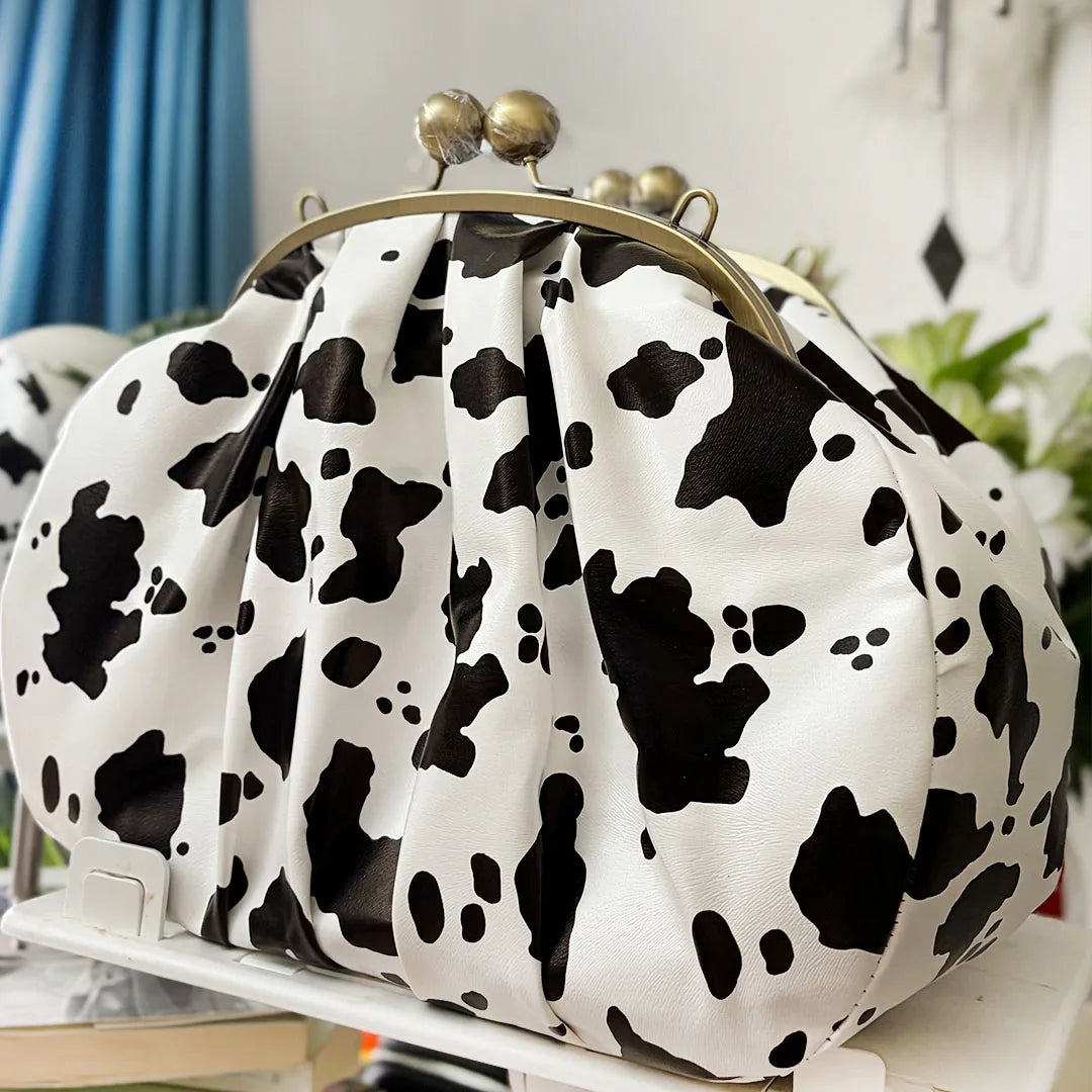 LOST IN VINTAGE Artficial Leather Cow Pattern Fabric Clutch Metal Frame Kiss Lock and Metal Handle Puffy Purse 34x23x11cm Cow