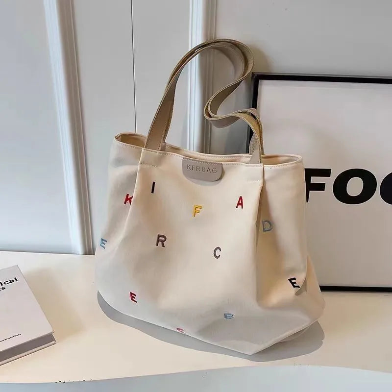 2025 New Canvas Bag Large Capacity Women's Trendy Embroidered Letter Tote Bag Small Fresh Student Shoulder Tote Bag