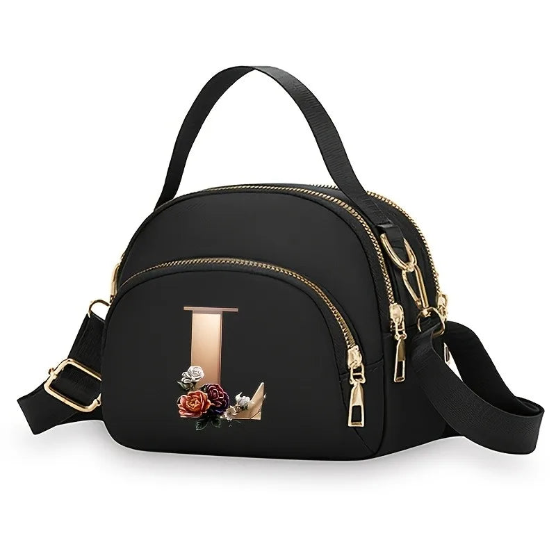 A fashionable women's messenger bag featuring a beautiful floral pattern with 26 letters, multiple compartments, and a large cap