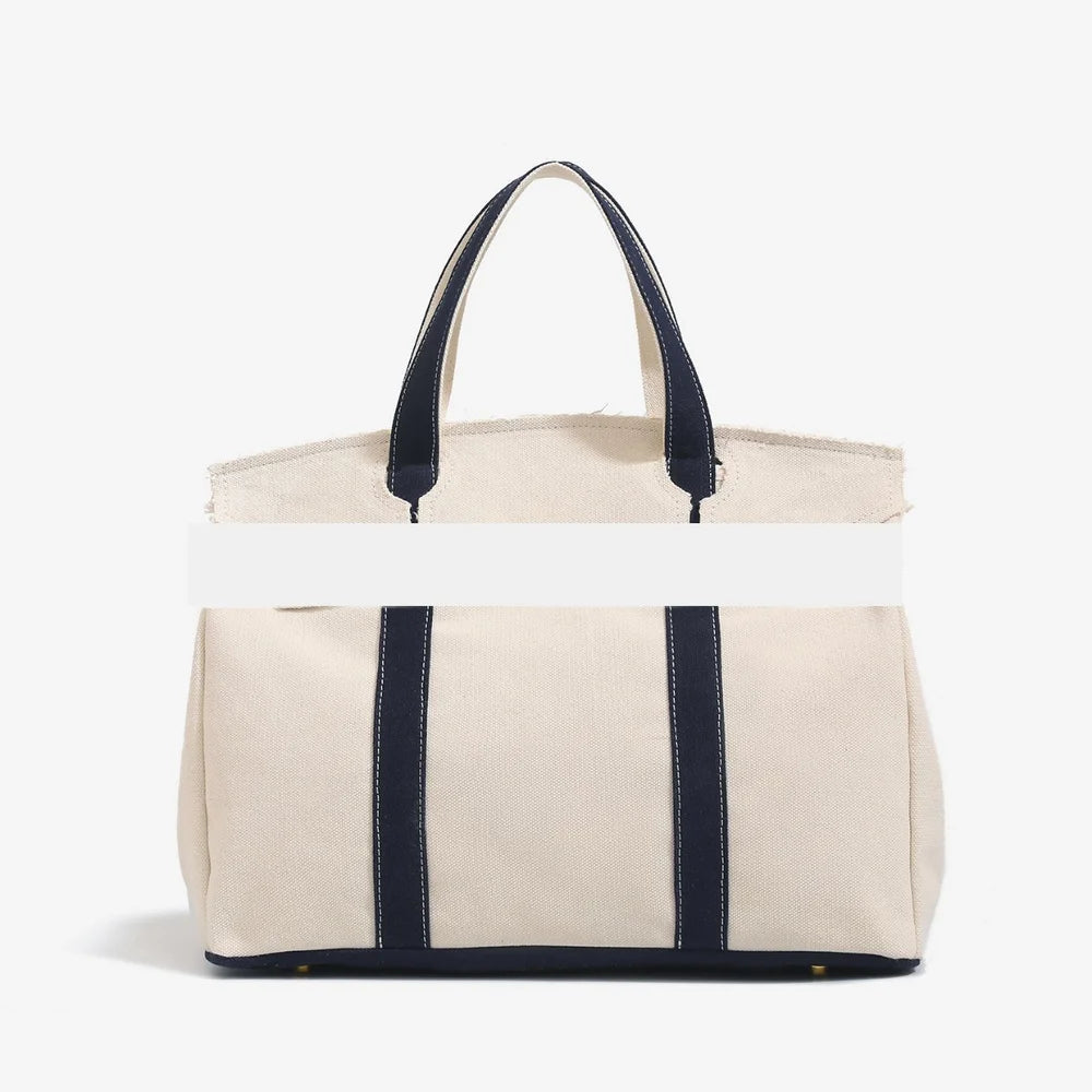 Canvas bag for women 2026 new high-end and niche design, contrasting color handbag, large capacity commuting versatile bag