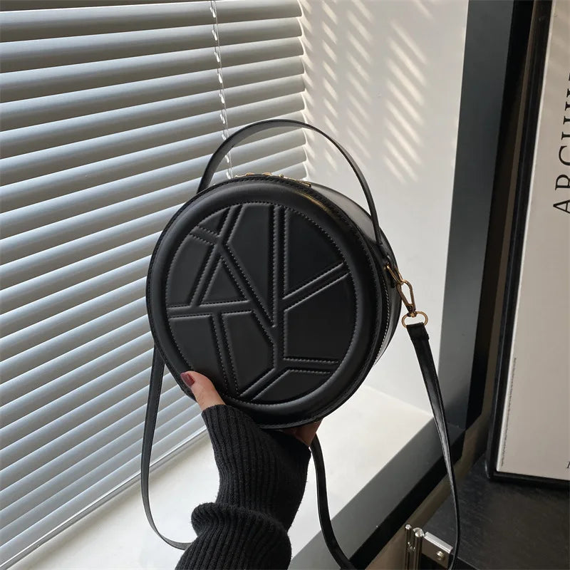 Solid color hand-held small round bag 2025 new bag, women's fashion shoulder bag, casual personalized crossbody bag