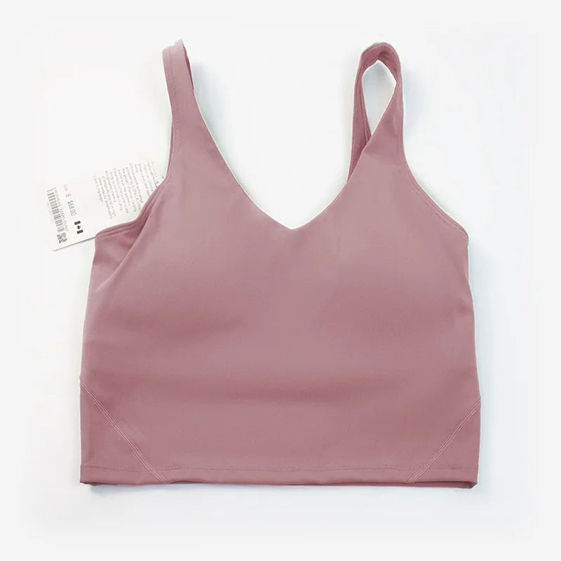 Women's yoga vest with U-shaped straps and built-in breast pads, offering a bare-skin feel suitable for fitness and exercise.