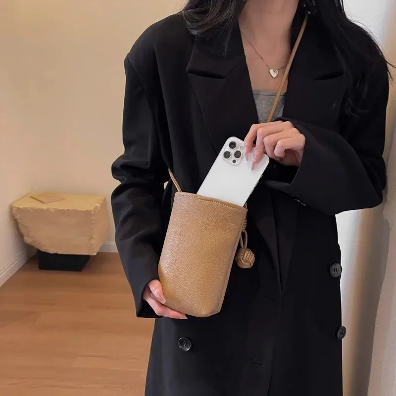 Versatile artistic small fresh small round ball pendant crossbody phone bag, soft leather cute mini bag for women