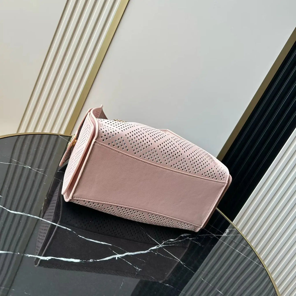 Light Pink Perforated Drawstring Bucket Bag, Interwoven Gold Chain Strap Hollow Grid Cutout Leather Crossbody Purse.