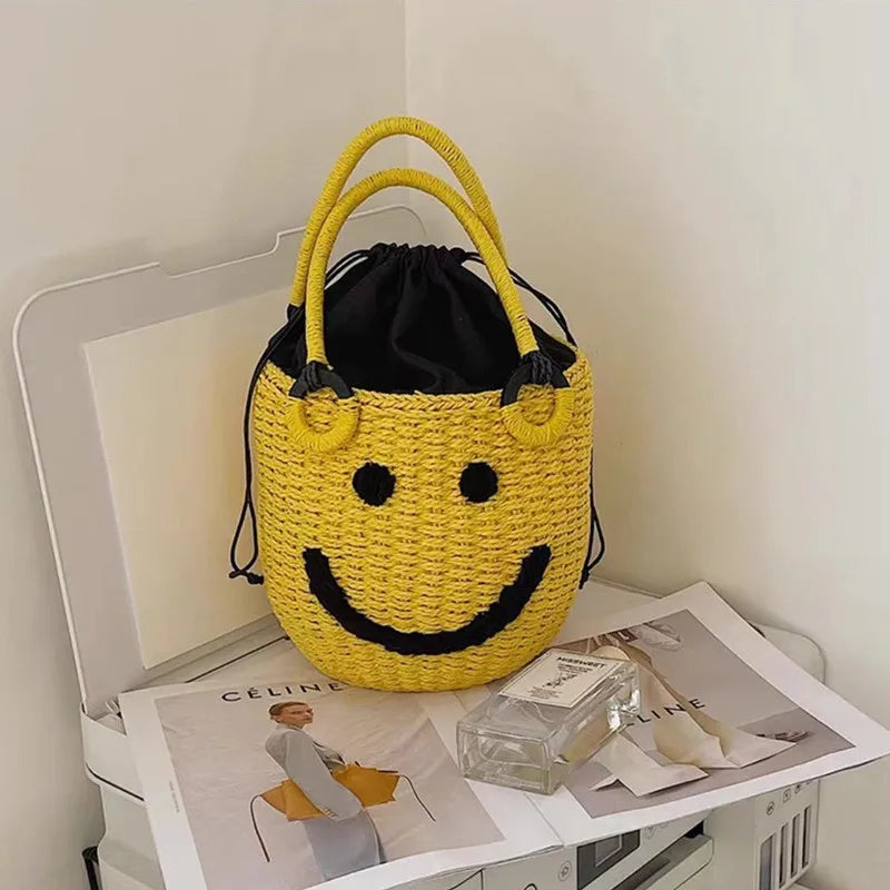2025 Summer New Smile Face Bucket Straw Woven Handbag Kawaii Small Beach Bag City Simple Style Double Strap Drawstring Closure