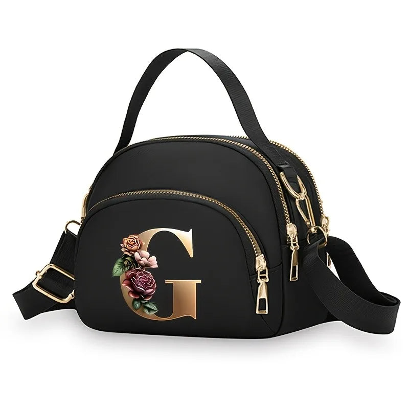 A fashionable women's messenger bag featuring a beautiful floral pattern with 26 letters, multiple compartments, and a large cap