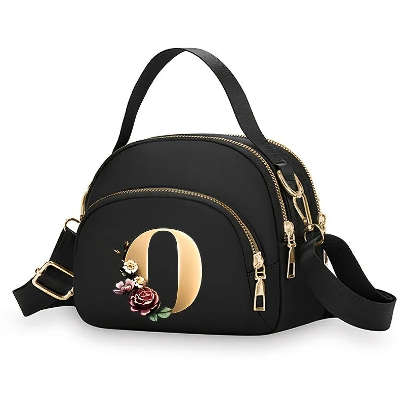 A fashionable women's messenger bag featuring a beautiful floral pattern with 26 letters, multiple compartments, and a large cap