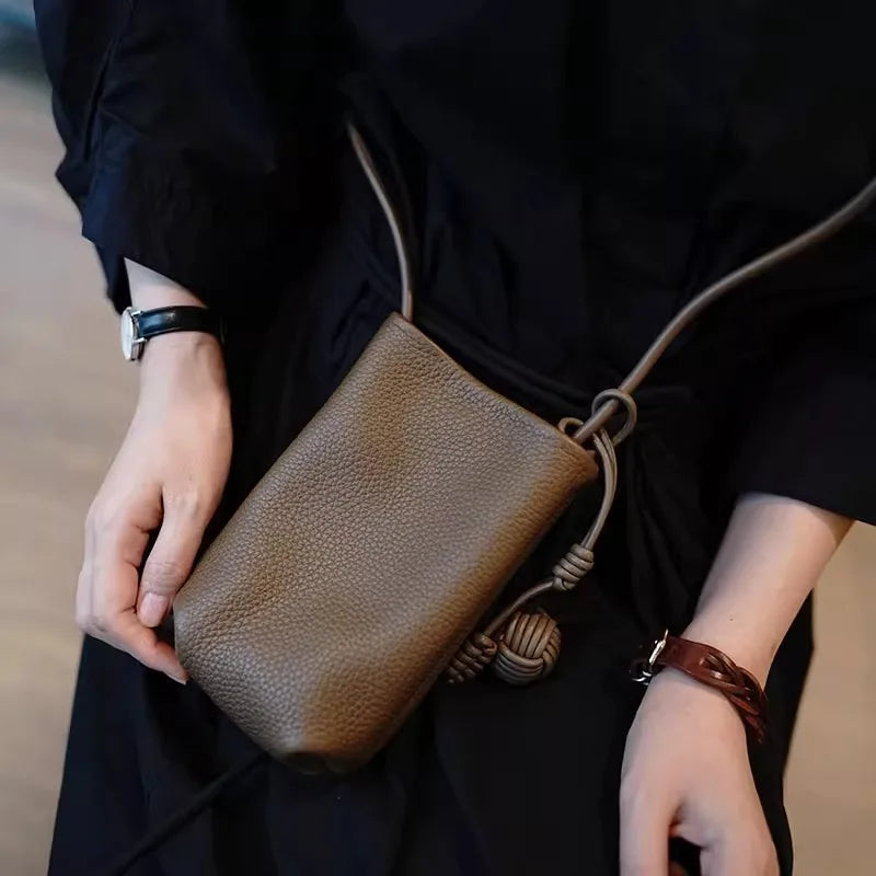 Versatile artistic small fresh small round ball pendant crossbody phone bag, soft leather cute mini bag for women