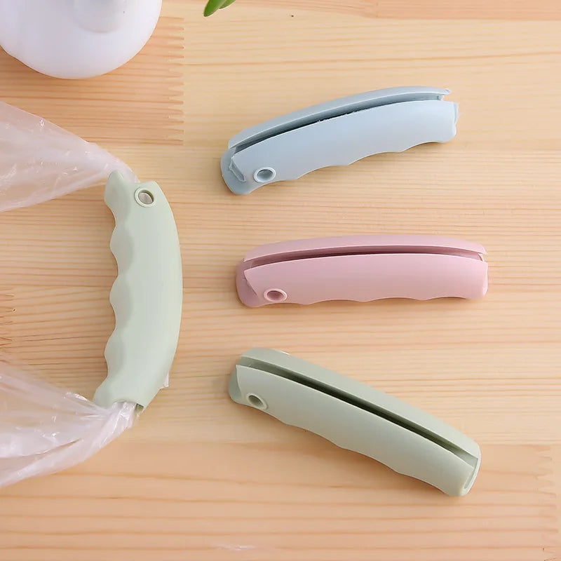 Silicone anti pinch hand effortless vegetable picker plastic bag handle