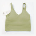 Women's yoga vest with U-shaped straps and built-in breast pads, offering a bare-skin feel suitable for fitness and exercise.