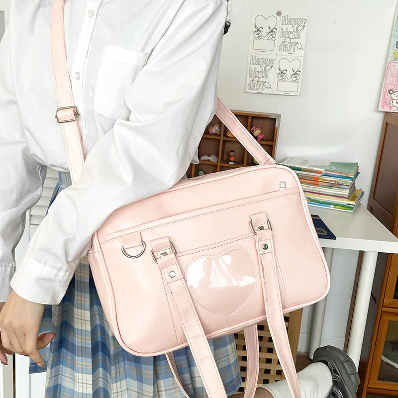 PU leather JK uniform single-shoulder heart large-capacity waterproof commuter crossbody bag for girls