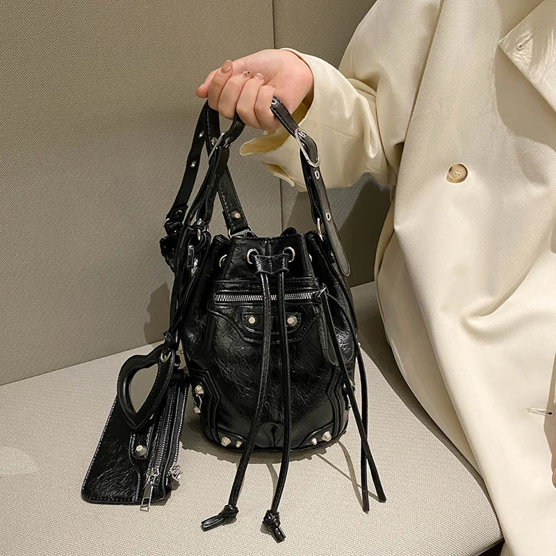 2025 Crossbody bag female new heavy industry locomotive wind rivet tide pump with bucket bag fashionable shoulder bag