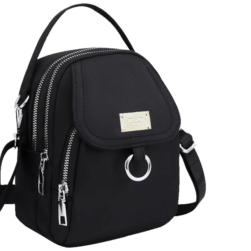 Neutral Style Shoulder Bag for Men and Women, Suitable for Travel and Photography It Is a Cross-Body Bag Made of Oxford Fabric.