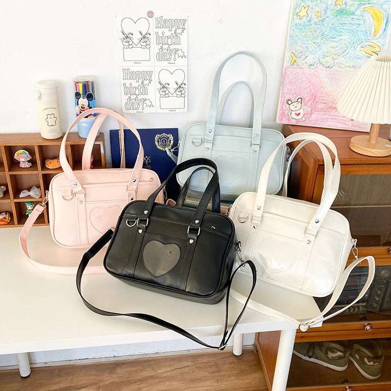 PU leather JK uniform single-shoulder heart large-capacity waterproof commuter crossbody bag for girls