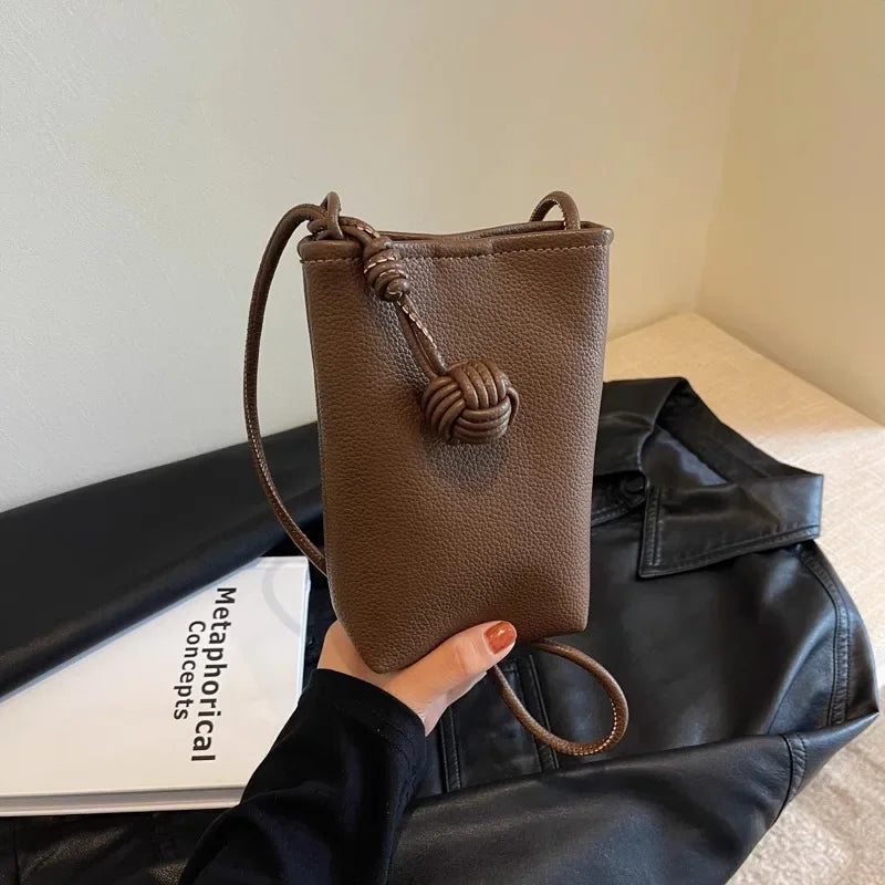 Versatile artistic small fresh small round ball pendant crossbody phone bag, soft leather cute mini bag for women