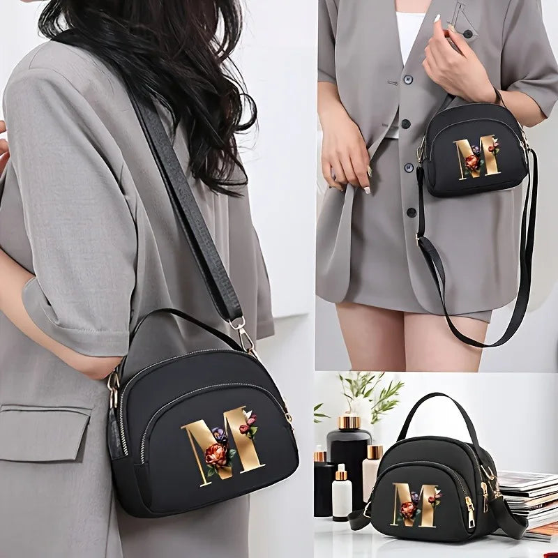 A fashionable women's messenger bag featuring a beautiful floral pattern with 26 letters, multiple compartments, and a large cap
