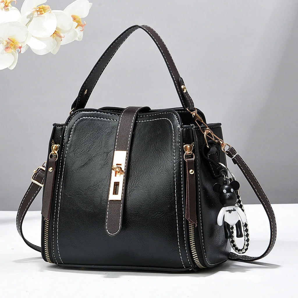 2026 New Fashionable Women's Bucket Bag Two tone Commuter Crossbody Bag ，with Pendant Student Handbag， Shoulder Bag。