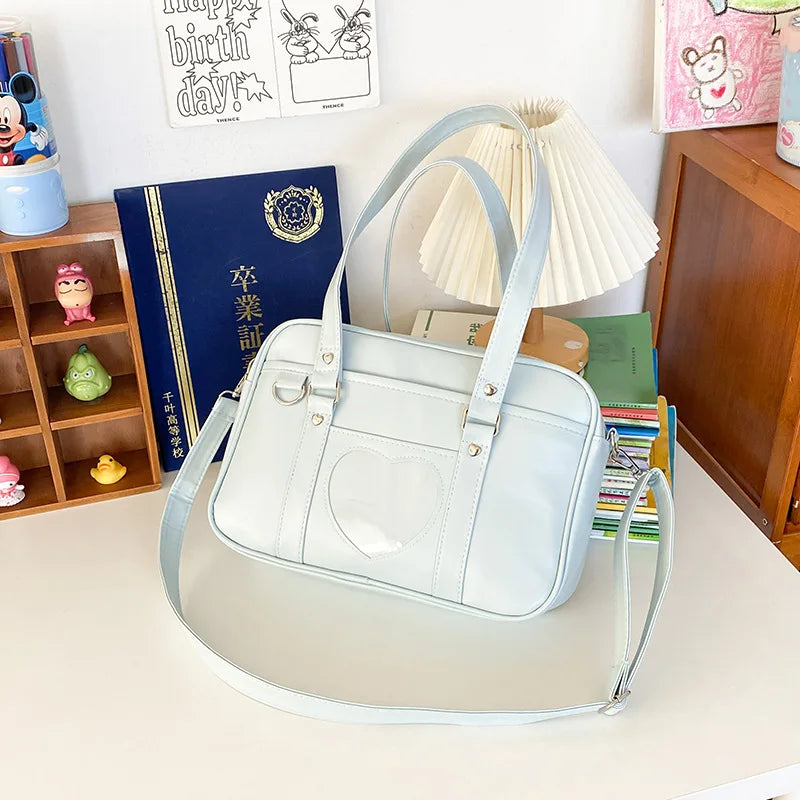 PU leather JK uniform single-shoulder heart large-capacity waterproof commuter crossbody bag for girls