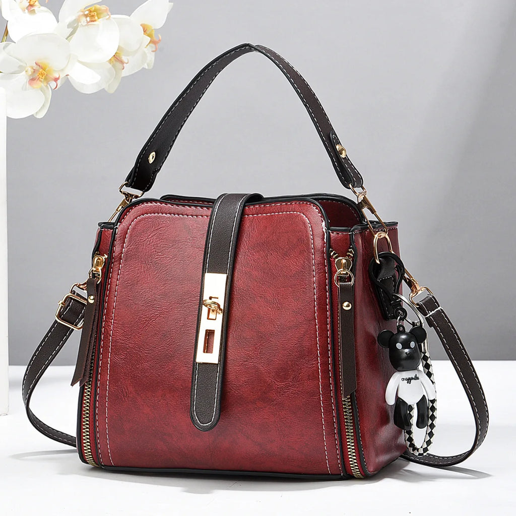 2026 New Fashionable Women's Bucket Bag Two tone Commuter Crossbody Bag ，with Pendant Student Handbag， Shoulder Bag。