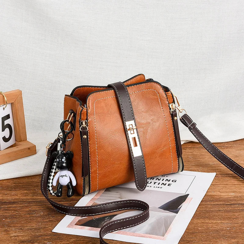 2026 New Fashionable Women's Bucket Bag Two tone Commuter Crossbody Bag ，with Pendant Student Handbag， Shoulder Bag。