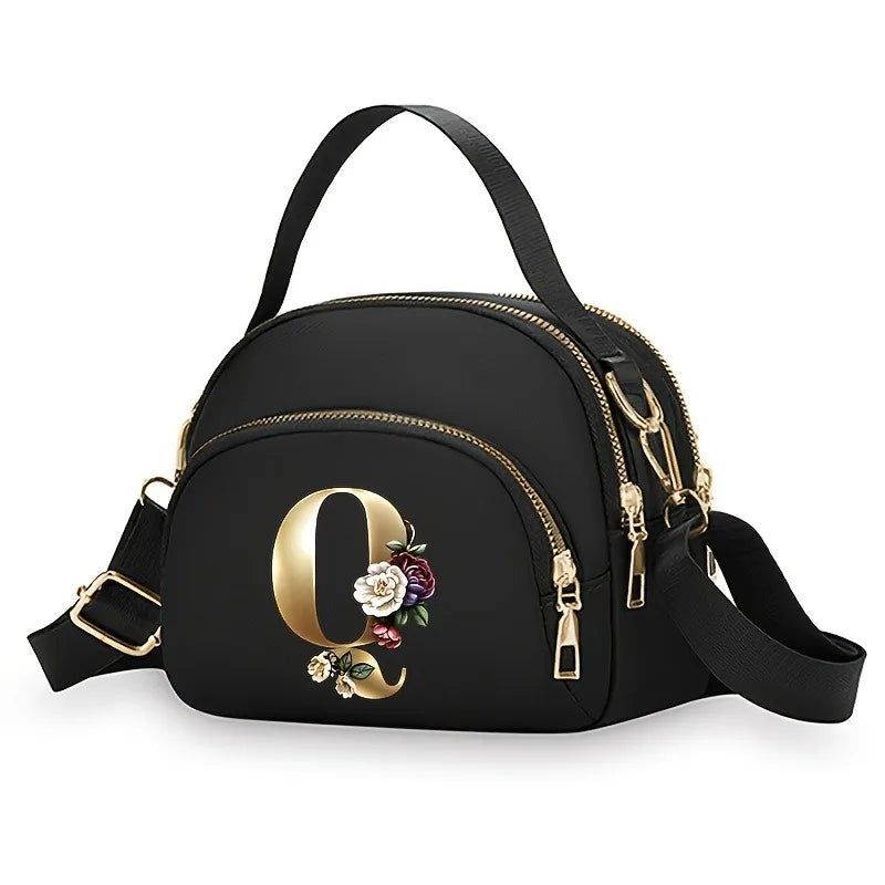 A fashionable women's messenger bag featuring a beautiful floral pattern with 26 letters, multiple compartments, and a large cap