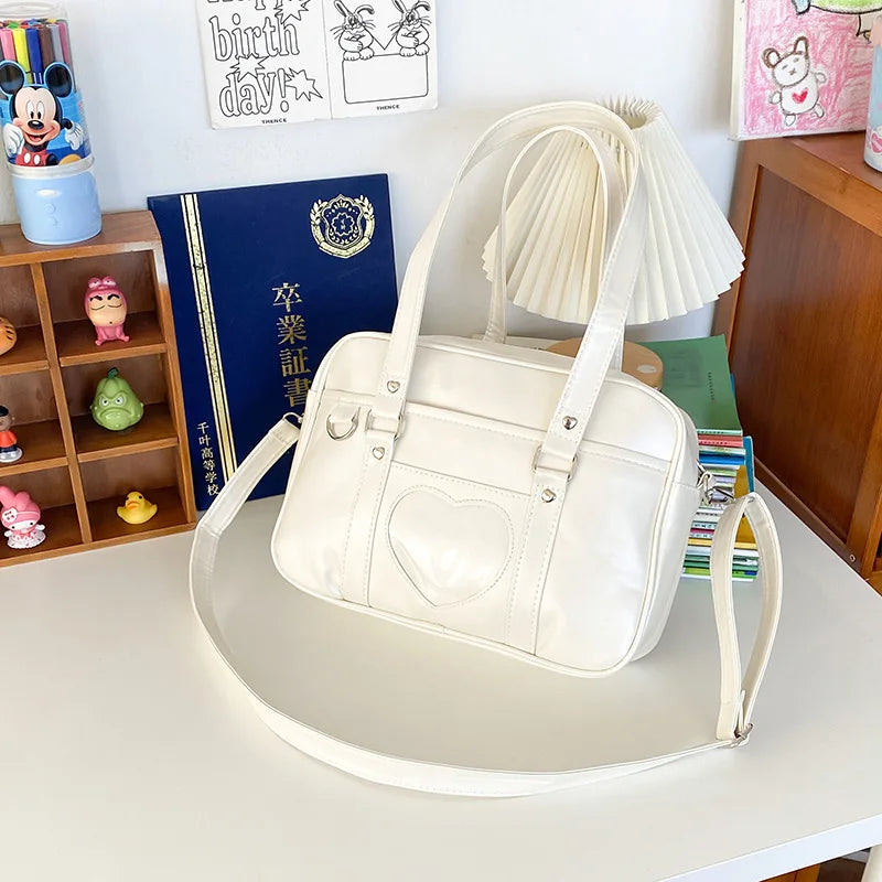 PU leather JK uniform single-shoulder heart large-capacity waterproof commuter crossbody bag for girls