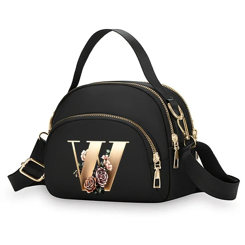 A fashionable women's messenger bag featuring a beautiful floral pattern with 26 letters, multiple compartments, and a large cap