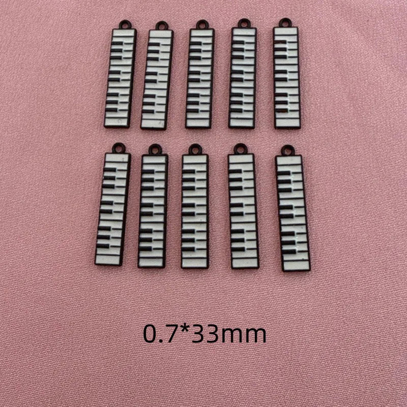 12pcs black and white minimalist alloy drip oil jewelry accessories, piano keyboard keychain, cartoon fashion earrings, hanging