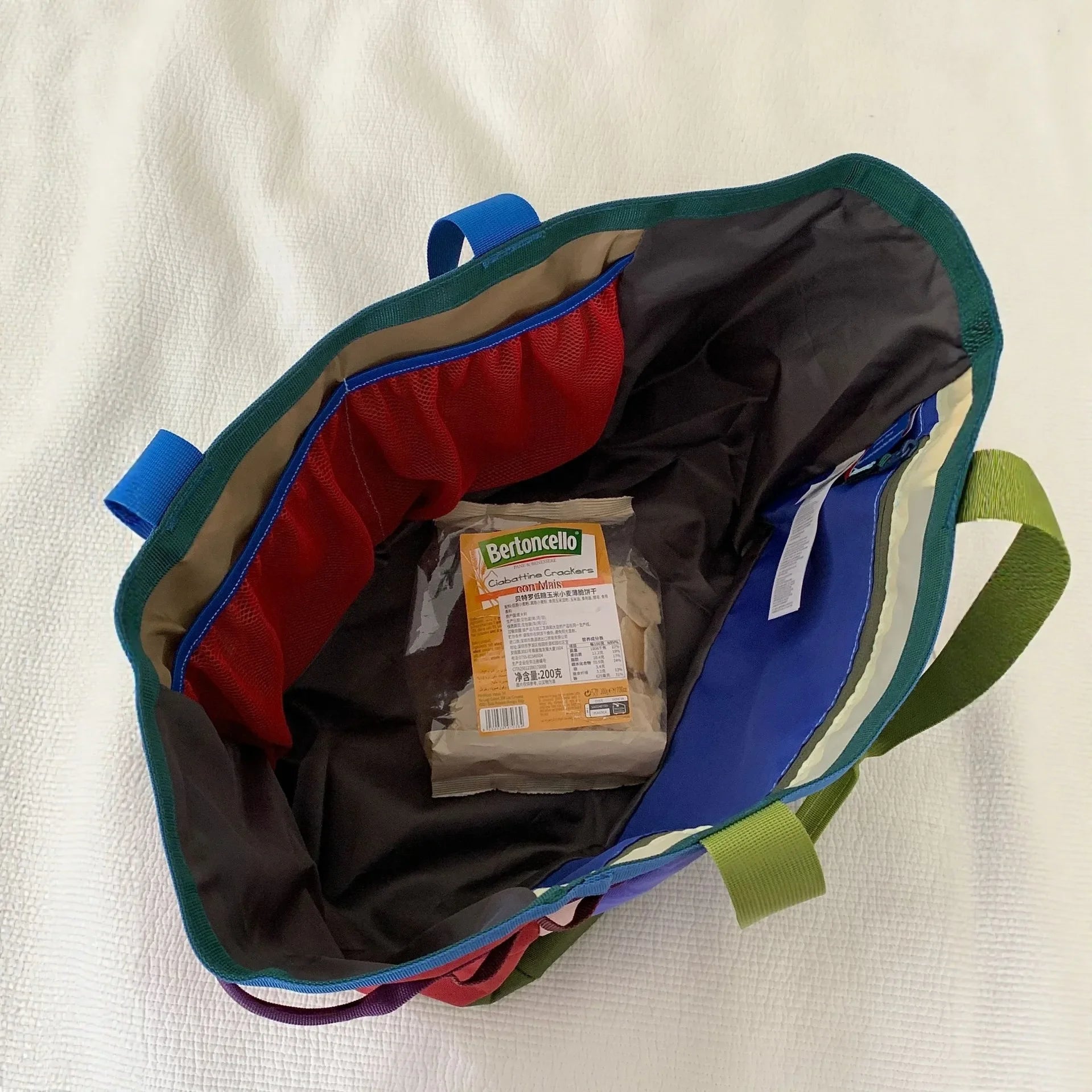 30L rainbow-colored patchwork nylon tote bag, large capacity with multiple side pockets, lightweight shoulder bag, suitable for shopping, travel, and daily outdoor activities.