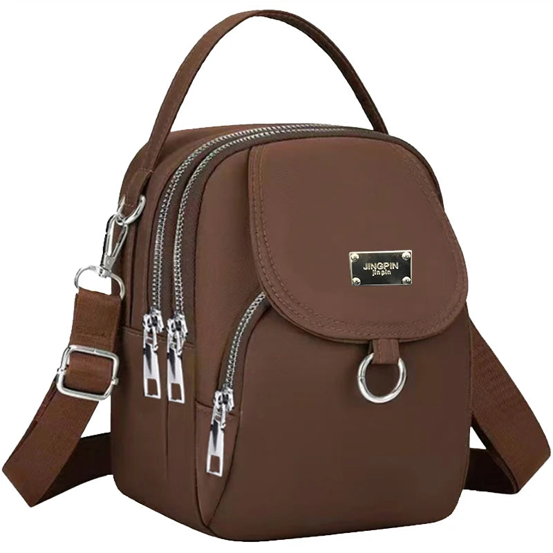 Neutral Style Shoulder Bag for Men and Women, Suitable for Travel and Photography It Is a Cross-Body Bag Made of Oxford Fabric.