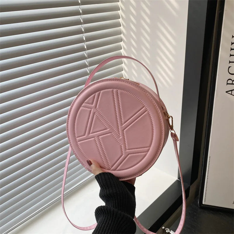Solid color hand-held small round bag 2025 new bag, women's fashion shoulder bag, casual personalized crossbody bag